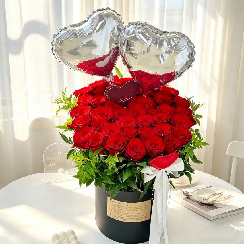33 Red Roses with 2 Silver Balloons in Hug Bucket